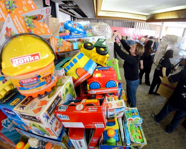 Large stack of toys at nonprofit toy drive